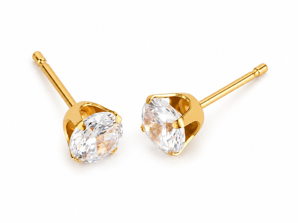 A pair of purepixxi 5mm Flawless Crystal claw-set studs in pure 24 karat gold.