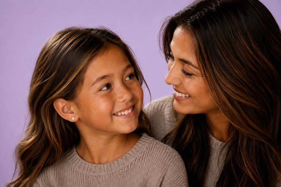 A mother and her daughter together, the daughter wearing a purepixxi stud earring.